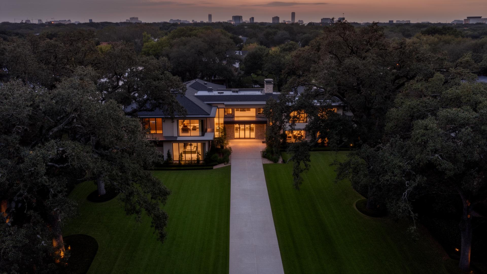 Aerial view of a modern luxury Memorial Houston estate at dusk